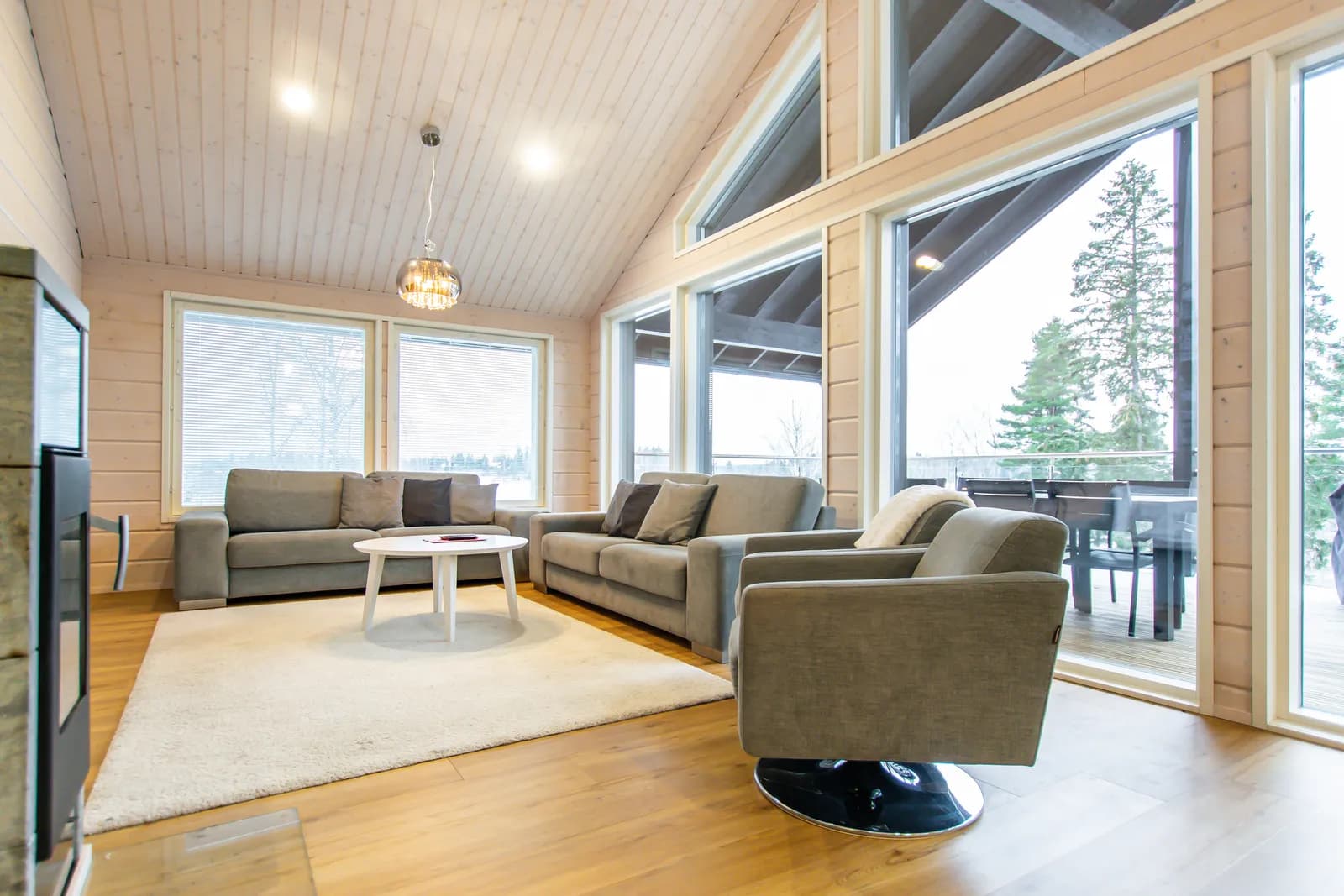 Salavan Tsaari living room with a fireplace and tall gable windows