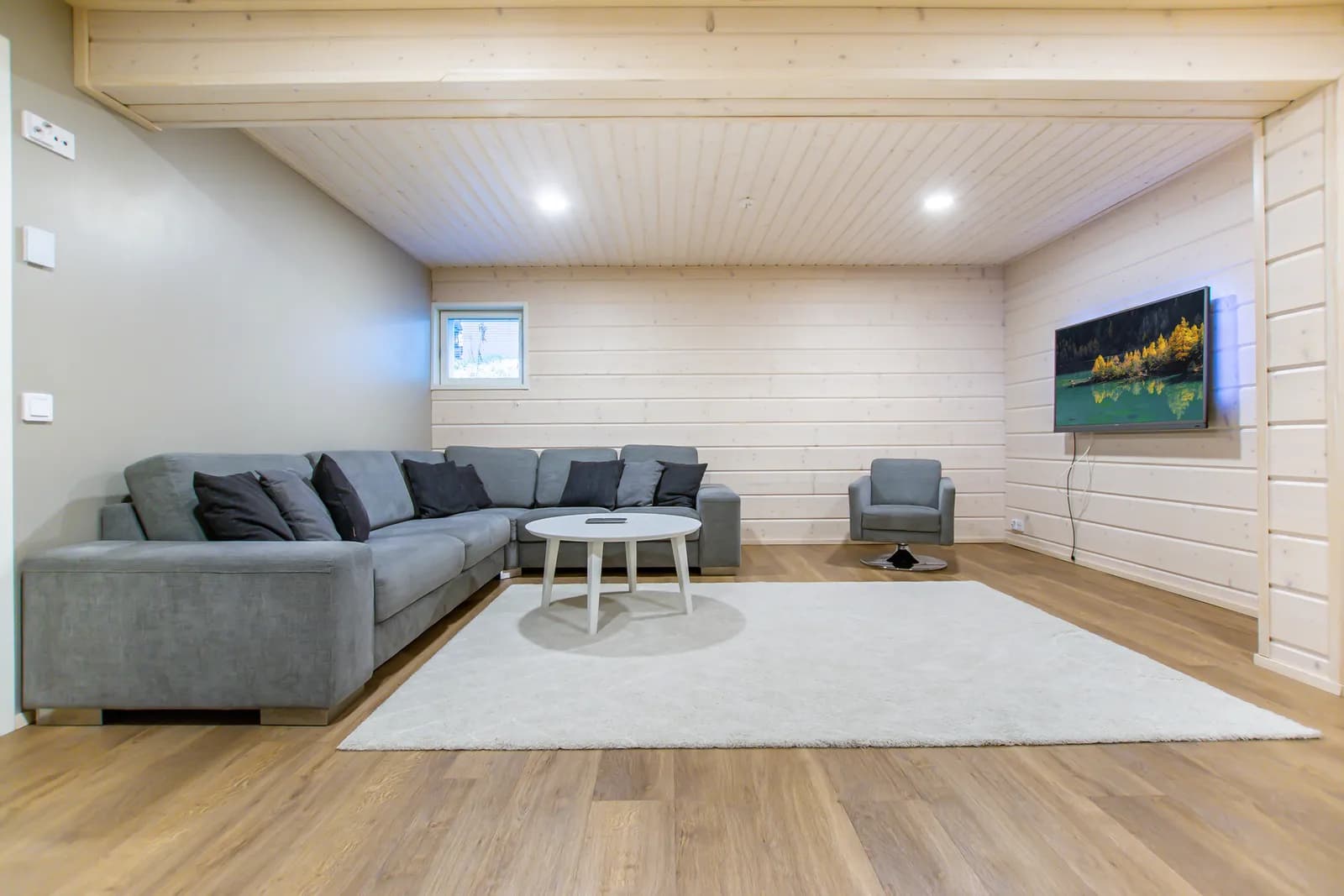 Downstairs TV lounge with a corner sofa at Salavan Tsaari